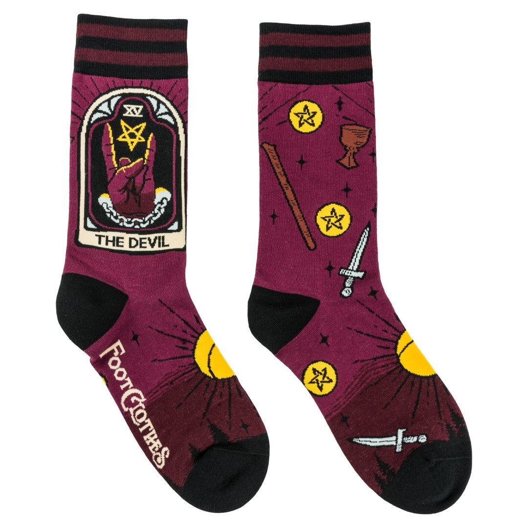 Maroon socks with tarot card design and 'The Devil' illustration on a white background