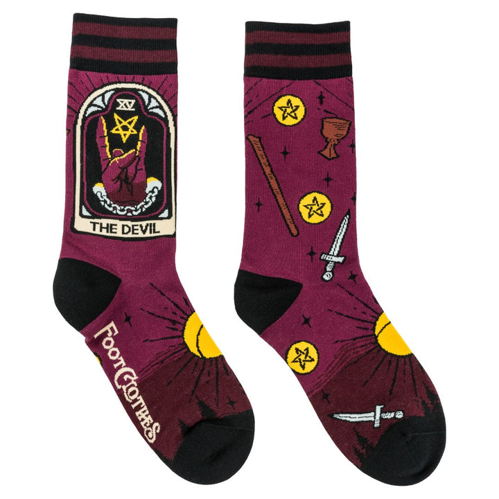 Maroon socks with tarot card design and 'The Devil' illustration on a white background
