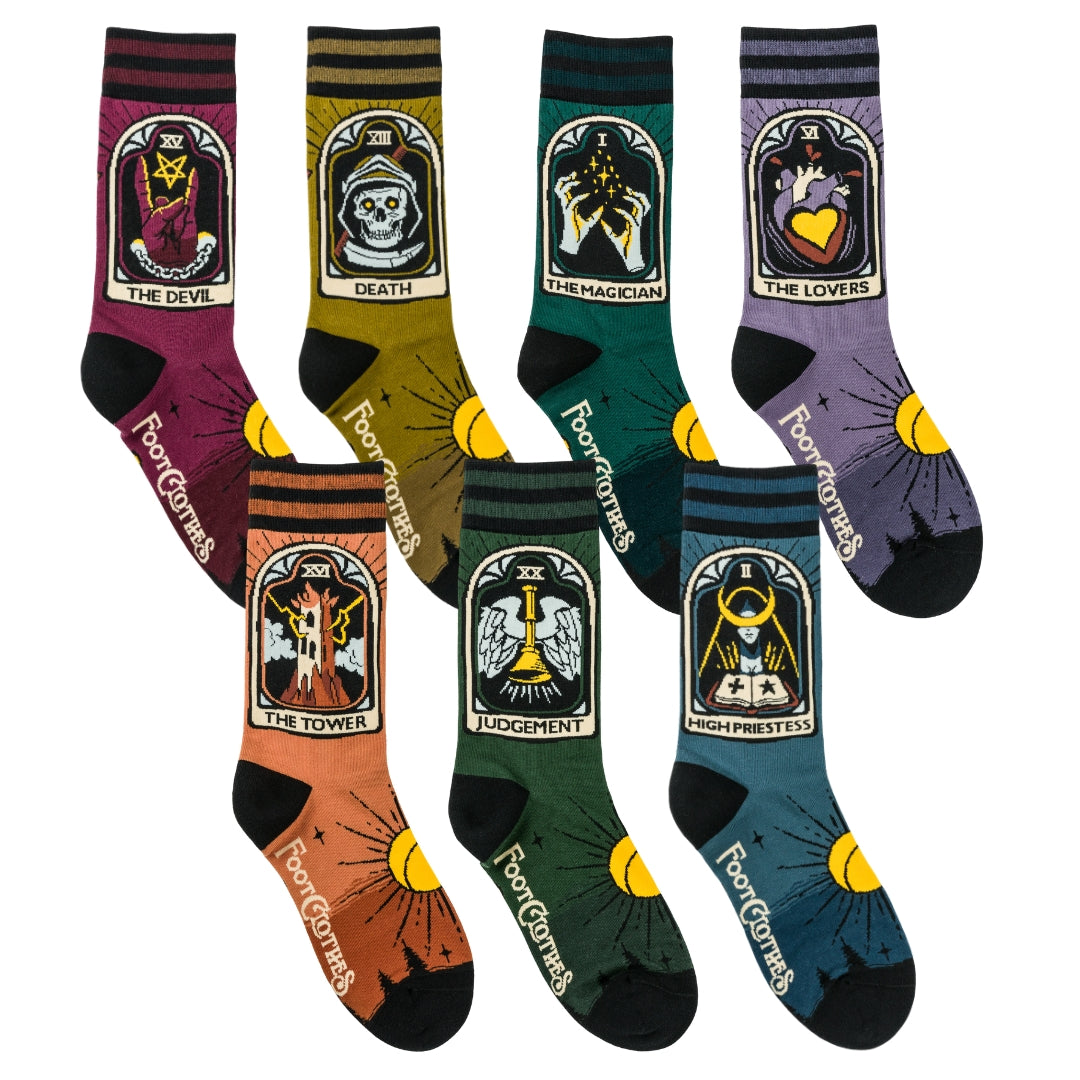 Set of tarot card-themed socks with colorful designs on a white background