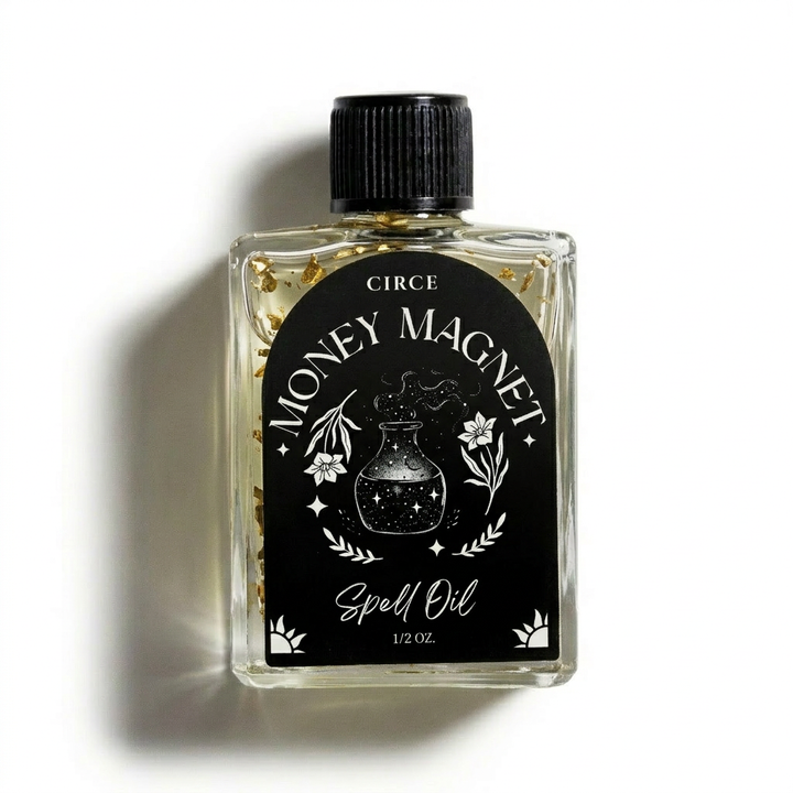 A 1 oz glass bottle of Circe Spell Oil containing clear oil with gold flakes, featuring a black cap and a black label with white text and illustrations reading 'MONEY MAGNET' and 'Spell Oil'.