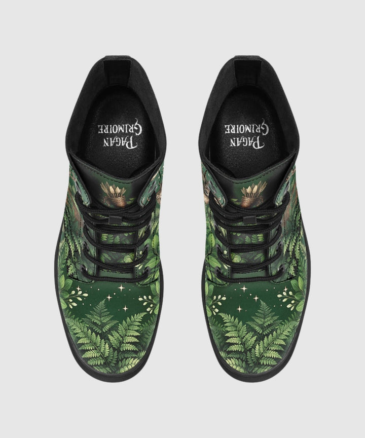 Artemis Boots show green botanical print with black laces and star accents.