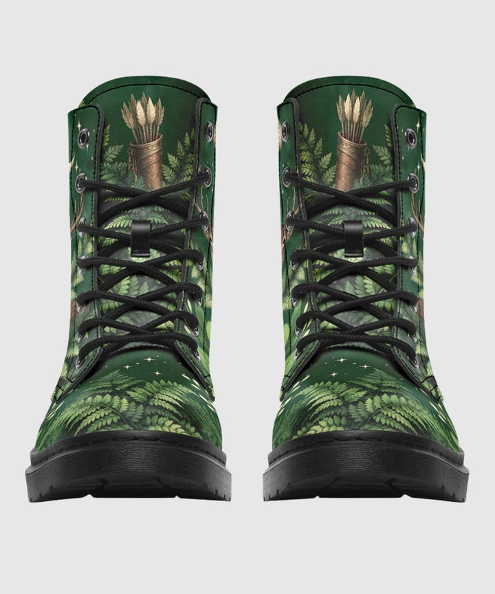 Artemis Boots show green woodland print, black laces, and sturdy black sole.