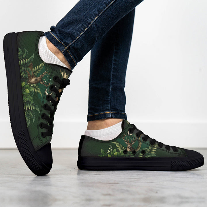 Artemis Low Tops in green with forest deer print, black laces, side view