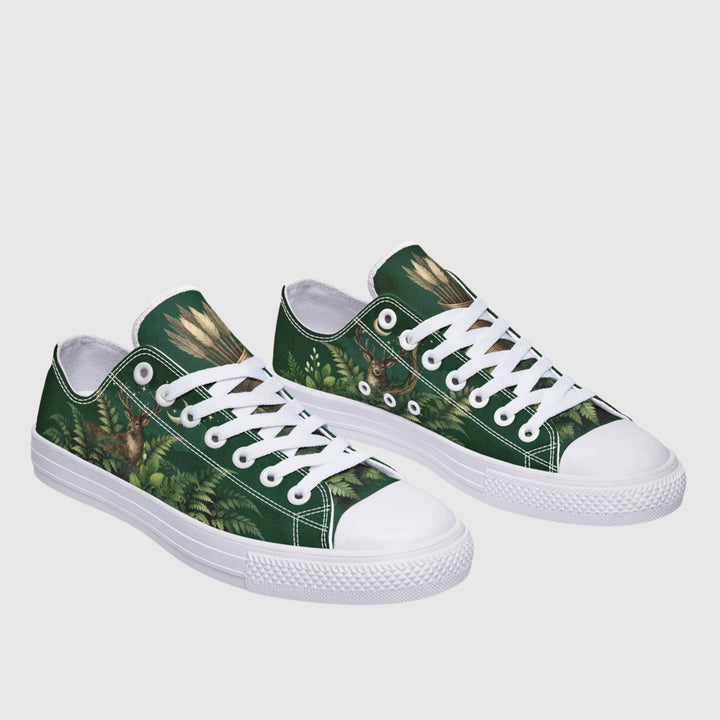 Artemis Low Tops show green forest print, white laces, and rubber toe caps.