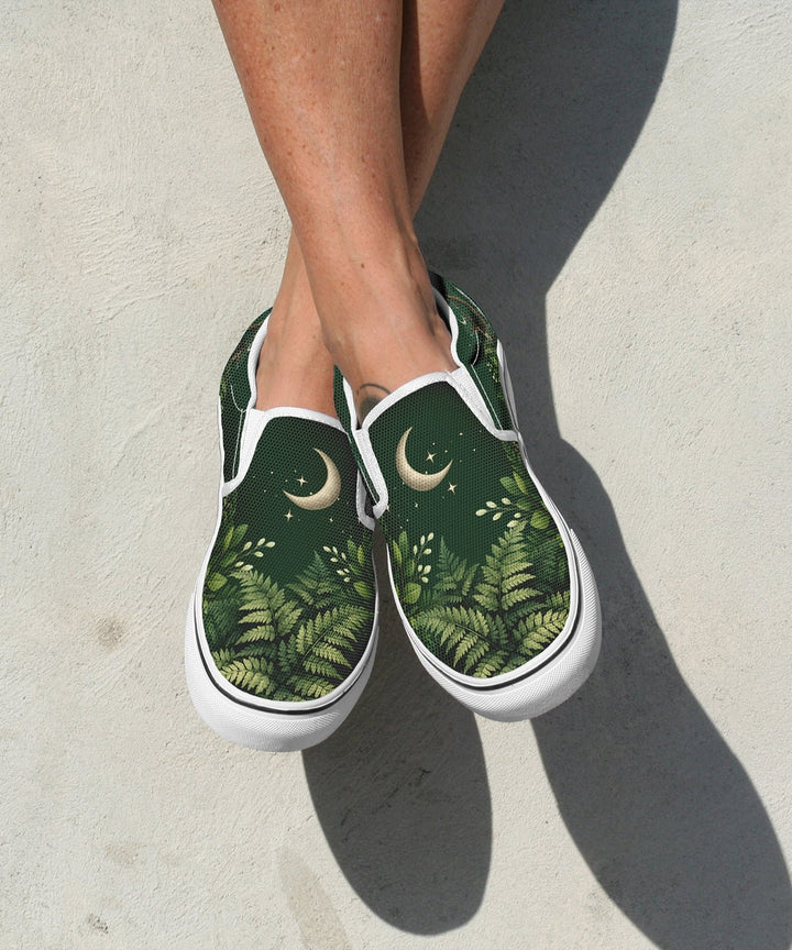 Artemis Slip On Shoes in green with forest print, white trim, moon icons.