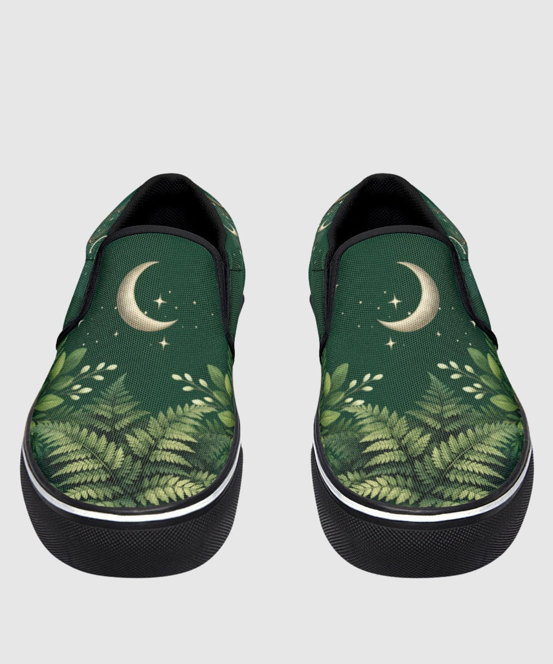 Artemis Slip On Shoes in green with moon and star print, black trim.