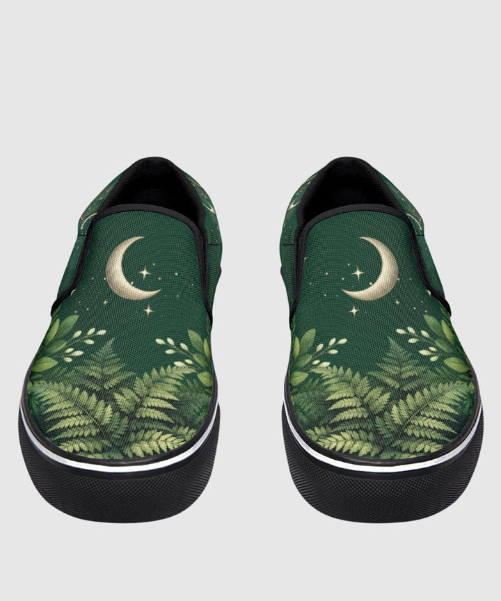 Artemis Slip On Shoes in green with moon and star print, black trim.