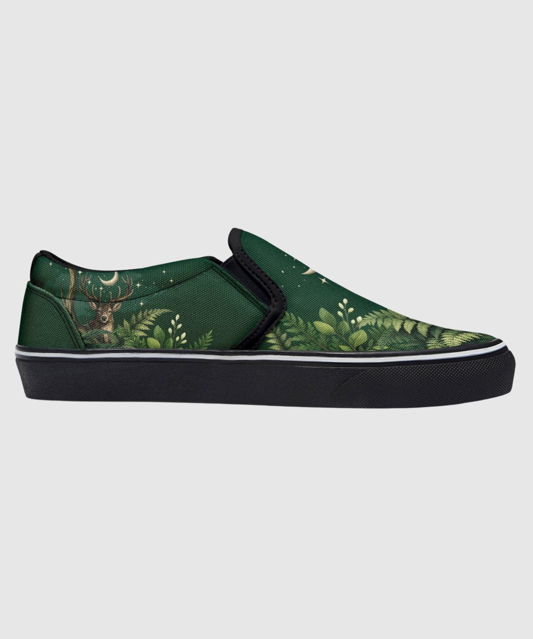 Artemis Slip On Shoes in green with deer and star print, black sole.