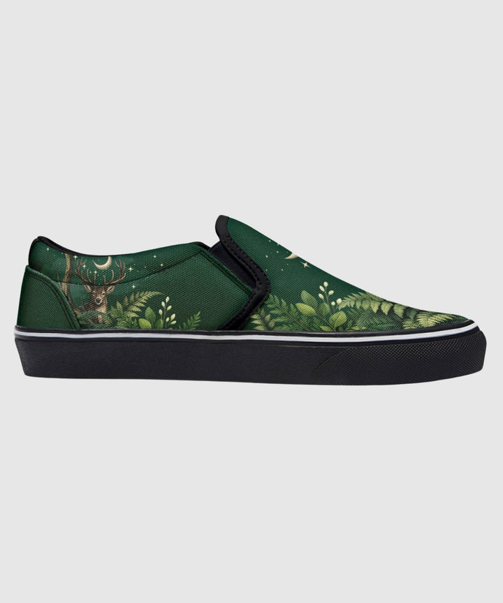 Artemis Slip On Shoes in green with deer and star print, black sole.