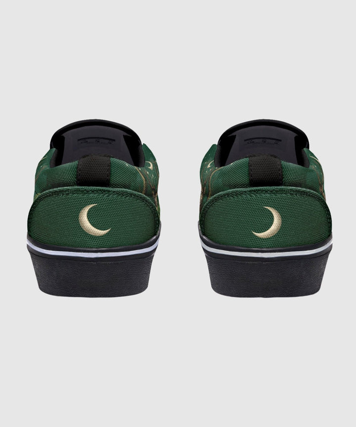 Artemis Slip On Shoes green canvas with black heel, white swoosh detail.