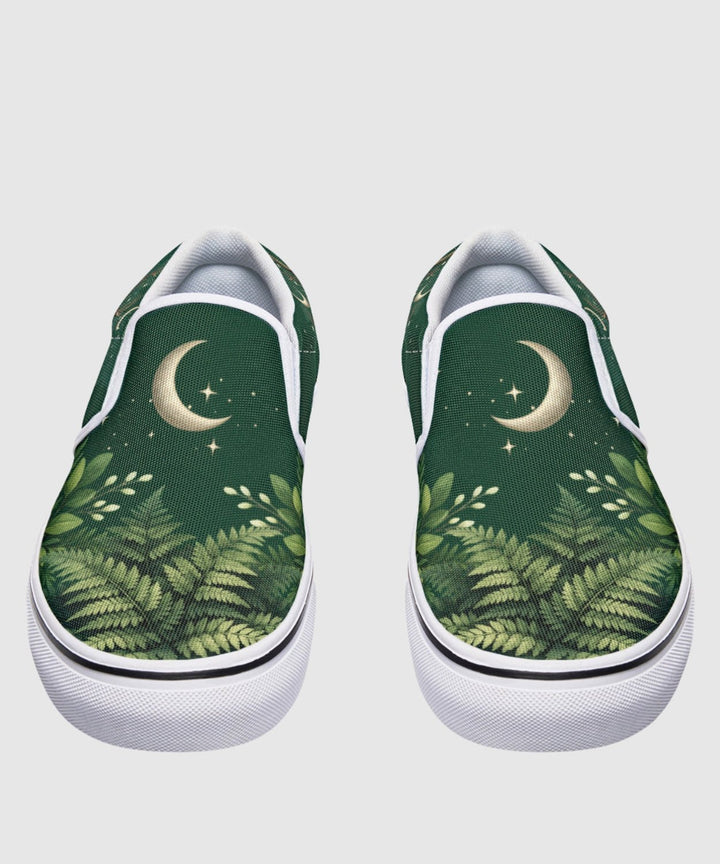 Artemis Slip On Shoes show green forest print with moon and stars.