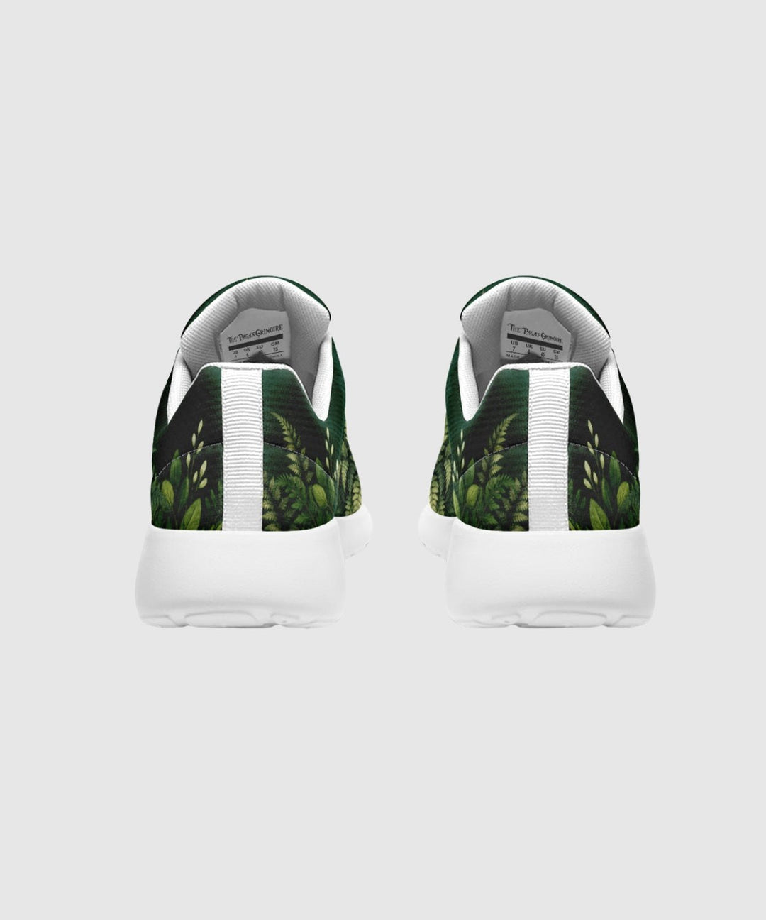 Artemis Sneakers rear view shows green leaf print panels, white sole, laces.