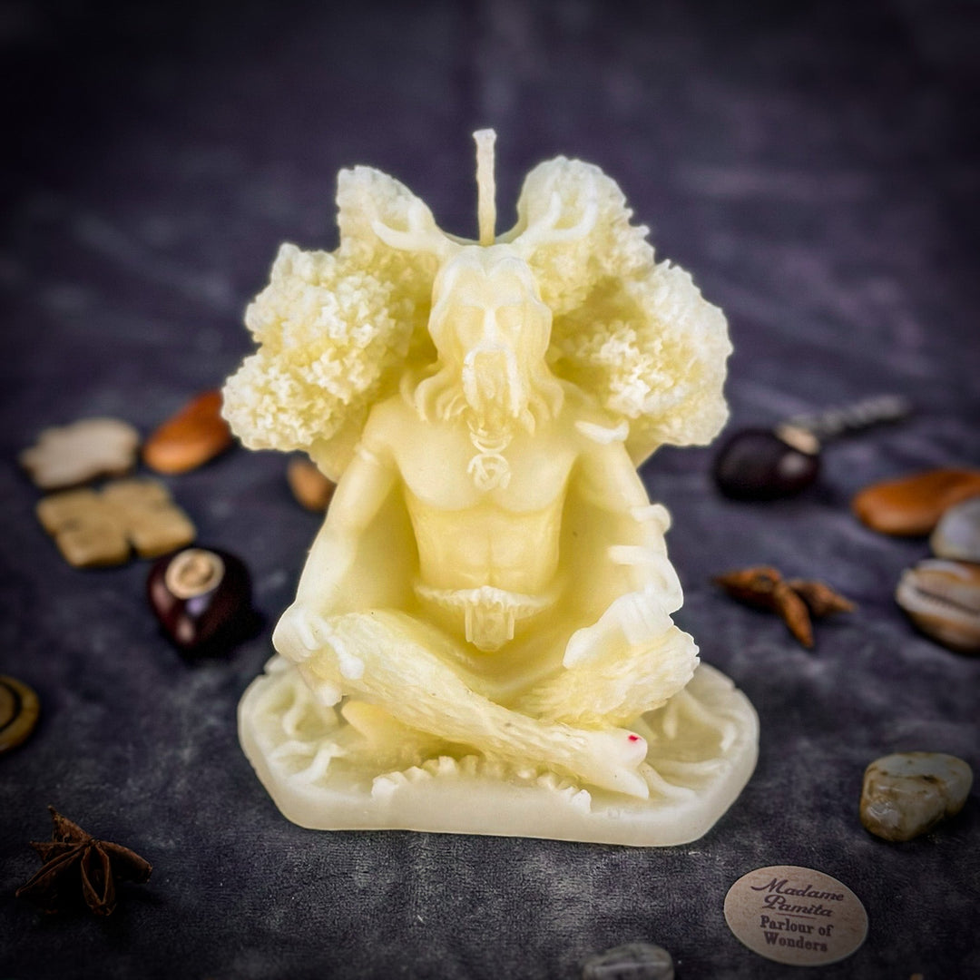 Beeswax Horned God Spell Candle detail shows pale figure, raised horns, and wick.