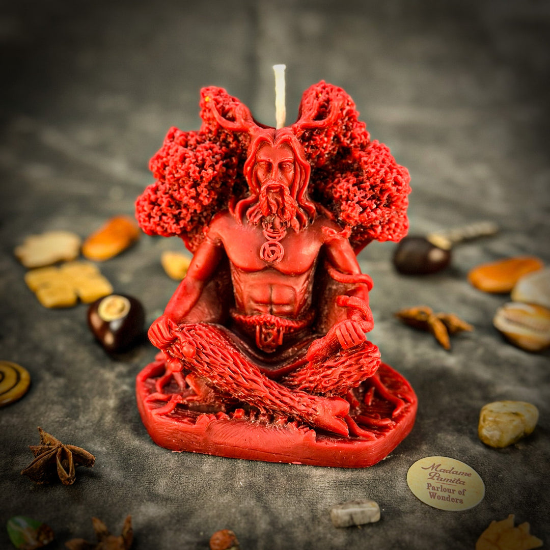 Beeswax Horned God Spell Candle, red figure with raised arms and lit wick.