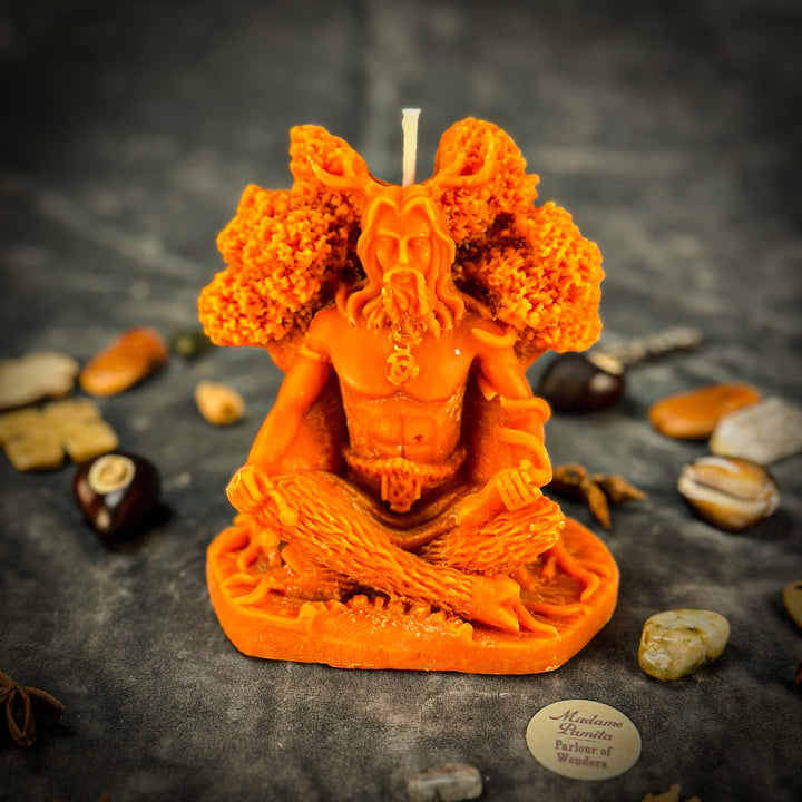 Beeswax Horned God Spell Candle detail shows orange figure with raised flame.