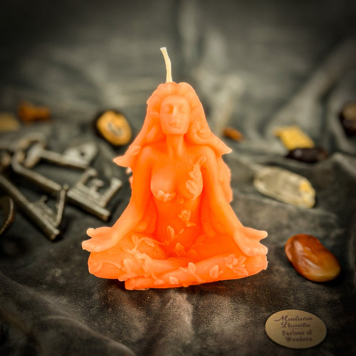 Beeswax Forest Fairy Spell Candle shaped like a glowing orange fairy, close-up.