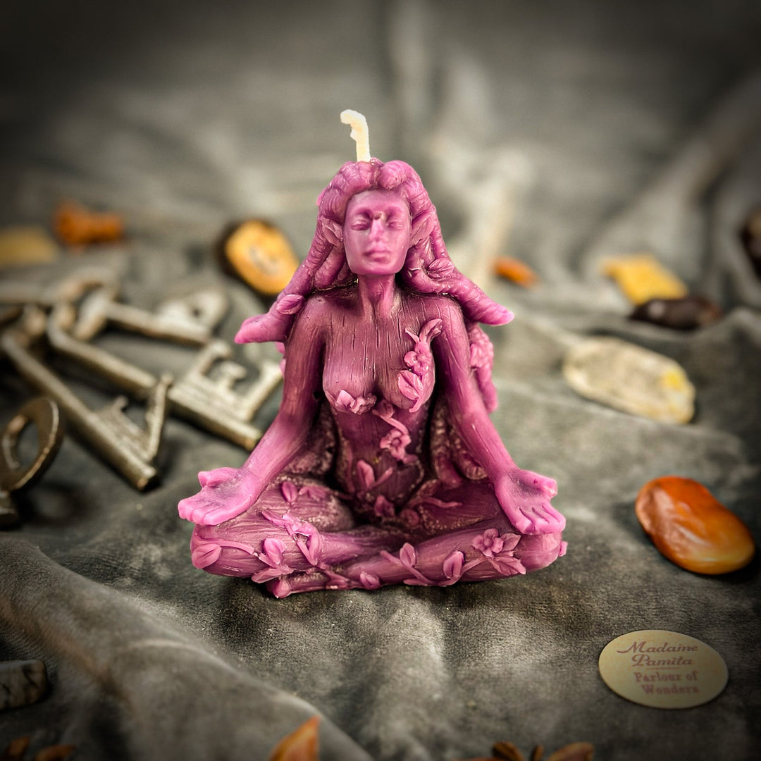 Beeswax Forest Fairy Spell Candle shaped figure in deep purple, lit wick.