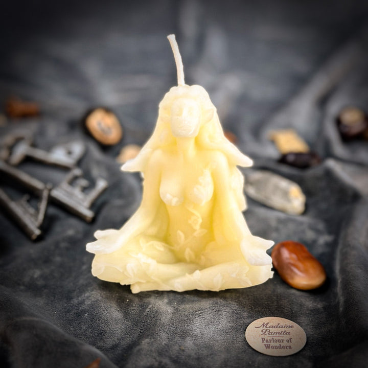 Beeswax Forest Fairy Spell Candle shaped like a glowing fairy, flame up.