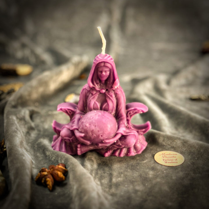 Beeswax Moon Goddess Spell Candle with pink robed figure, lit flame.