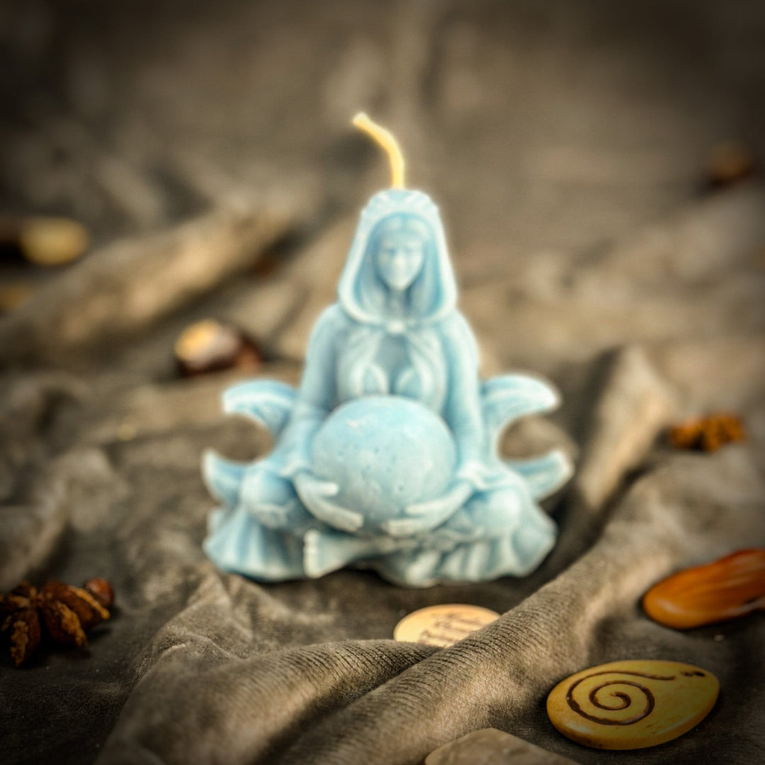 Beeswax Moon Goddess Spell Candle flame above blue star-shaped wax holder.