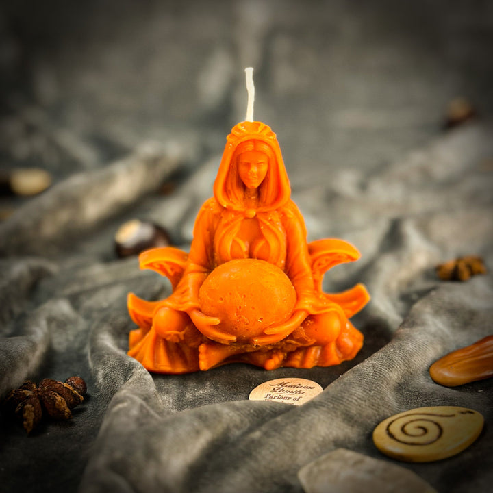 Beeswax Moon Goddess Spell Candle shows a glowing orange figure with raised flame.