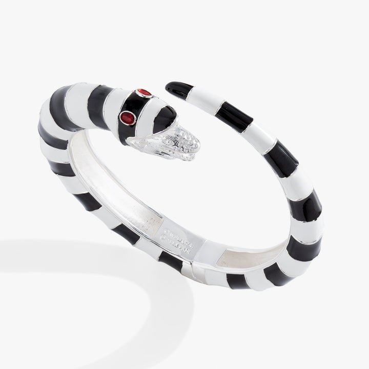 Black and white striped bracelet with red accents on a white background