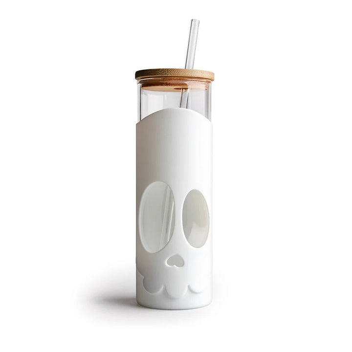 Clear tumbler with white skull design, wooden lid, and straw on a white background