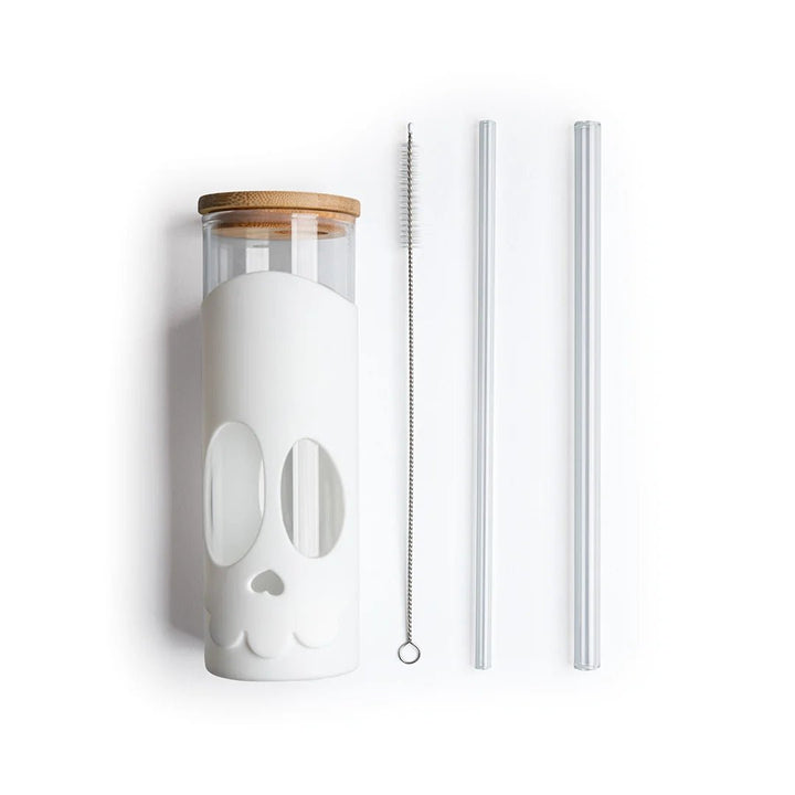 White tumbler with bamboo lid and straws on a white background