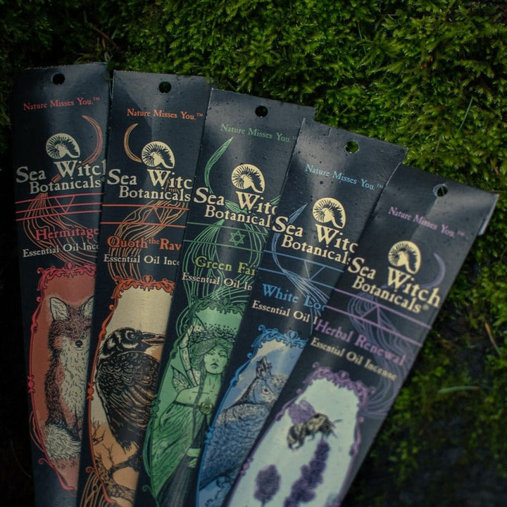 Incense Gift Set detail showing five hanging packets on green foliage backdrop