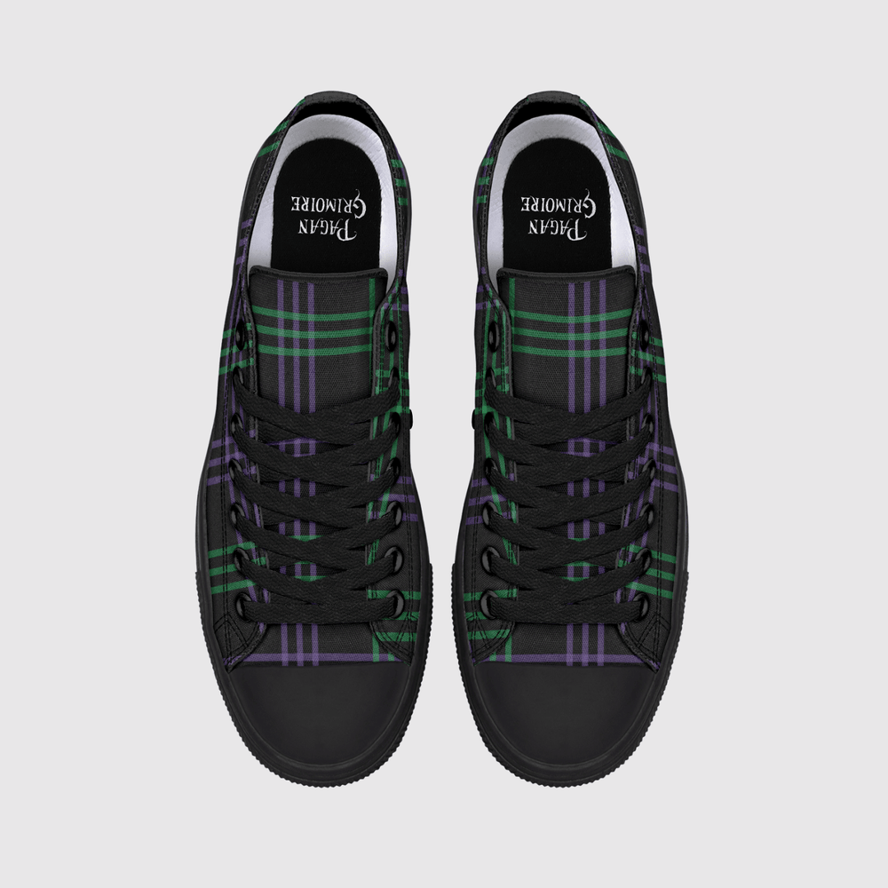 A pair of black high-top sneakers with a green and purple tartan plaid pattern on the canvas uppers, shown from a top-down view on a light gray background.