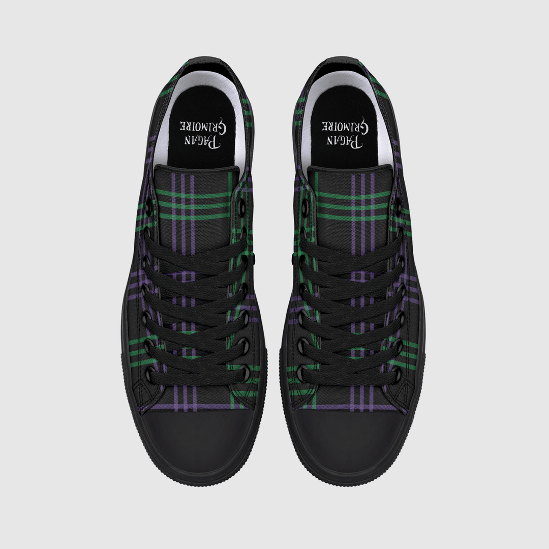 A pair of black high-top sneakers with a green and purple tartan plaid pattern on the canvas uppers, shown from a top-down view on a light gray background.