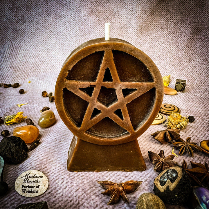 Beeswax Pentacle of Protection Spell Candle with star pentagram cutout, gold-brown.
