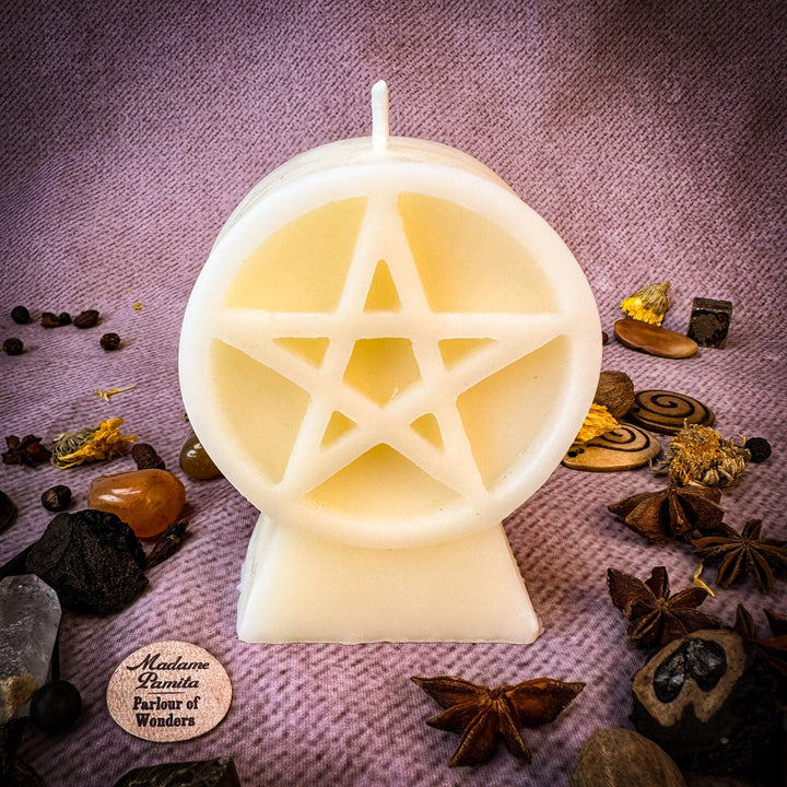 Beeswax Pentacle of Protection Spell Candle shows a glowing pentagram cutout.