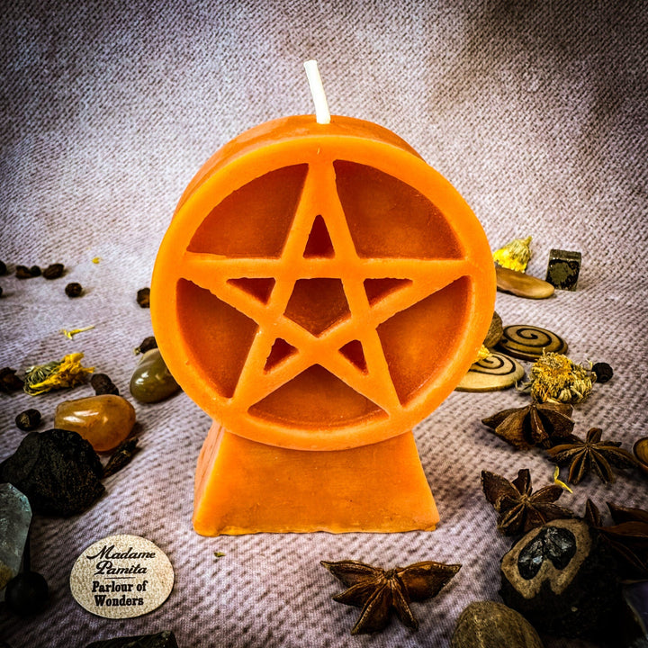 Beeswax Pentacle of Protection Spell Candle with orange pentagram cutout and white wick.