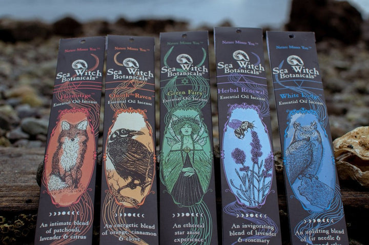 Incense Gift Set detail view of five illustrated card packs in sea-green, blue, purple, and red.