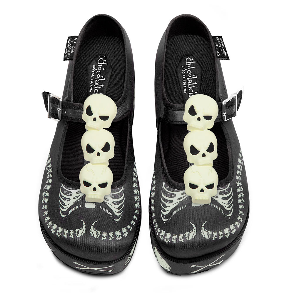 Black Mary Jane platform shoes with skeleton charm appliques and buckle straps