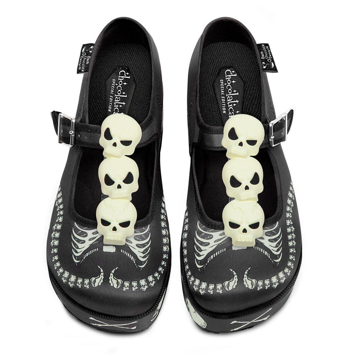 Black Mary Jane platform shoes with skeleton charm appliques and buckle straps