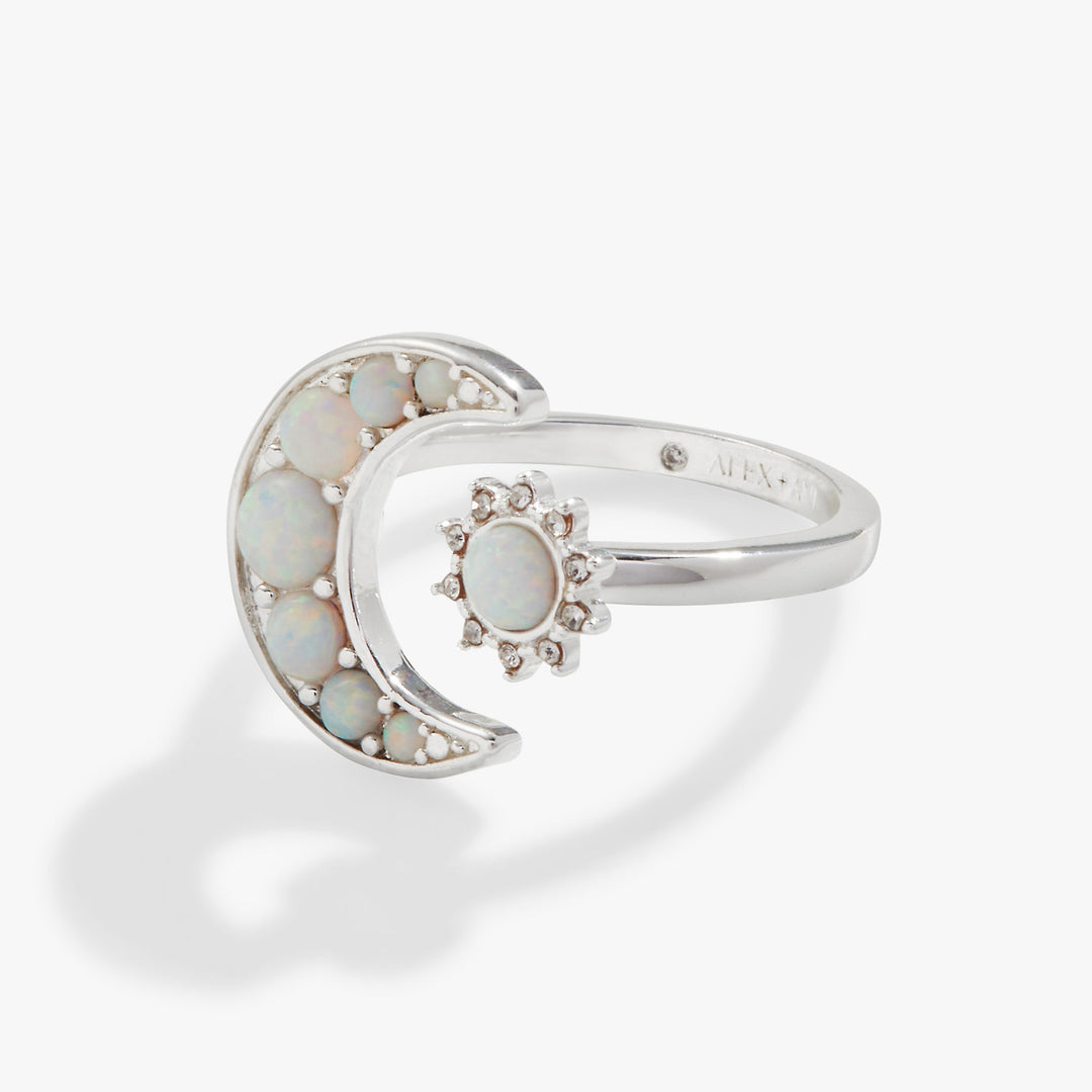Silver ring with opal stones on a white background