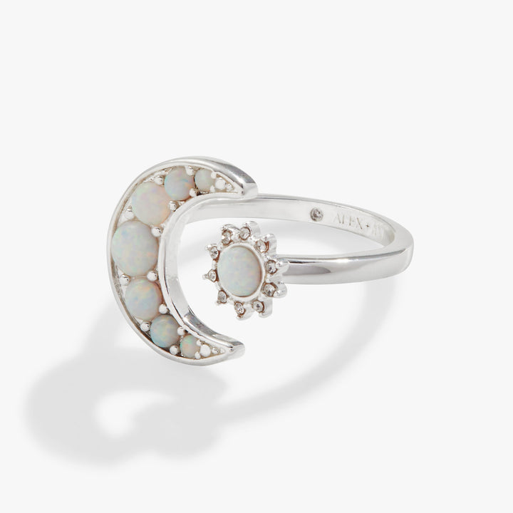 Silver ring with opal stones on a white background
