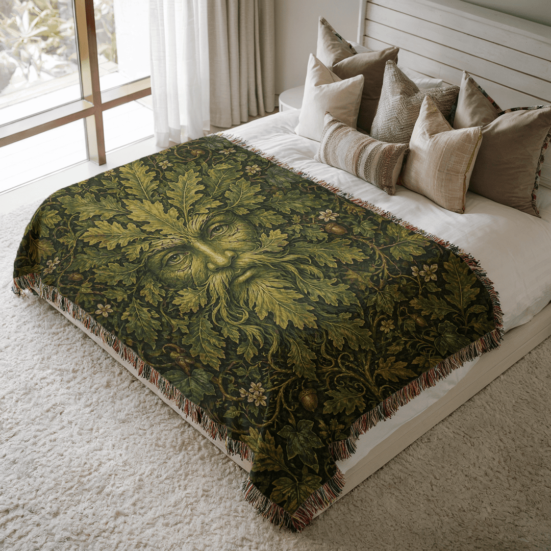 Decorative green man-patterned throw blanket on a bed with pillows in a bright bedroom.
