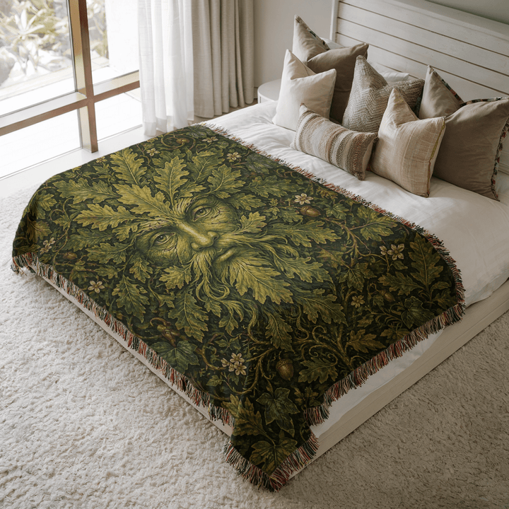 Decorative green man-patterned throw blanket on a bed with pillows in a bright bedroom.