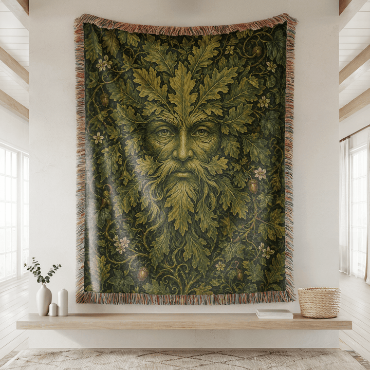 Woven tapestry with a leafy green man design hanging on a wall.