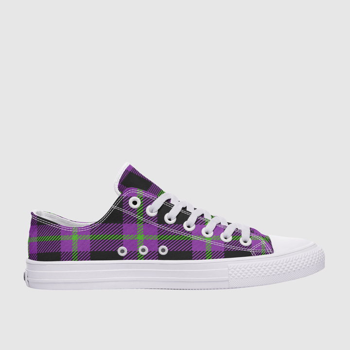 A low-top canvas sneaker featuring a purple and black plaid pattern with lime green accents, white laces, and a white rubber sole, shown against a light gray background.