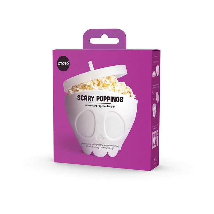 Purple packaging of a popcorn maker with 'Scary Poppings' text on a white background