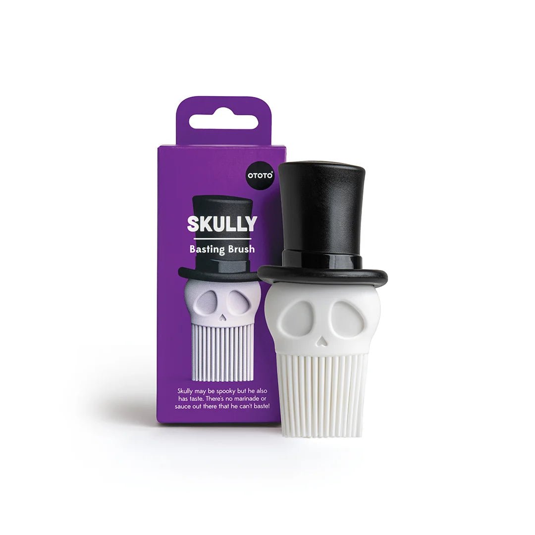 Skull-shaped basting brush with top hat packaging on a white background