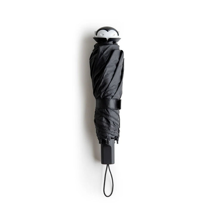 A black umbrella shown closed, hanging vertically against a plain white background.