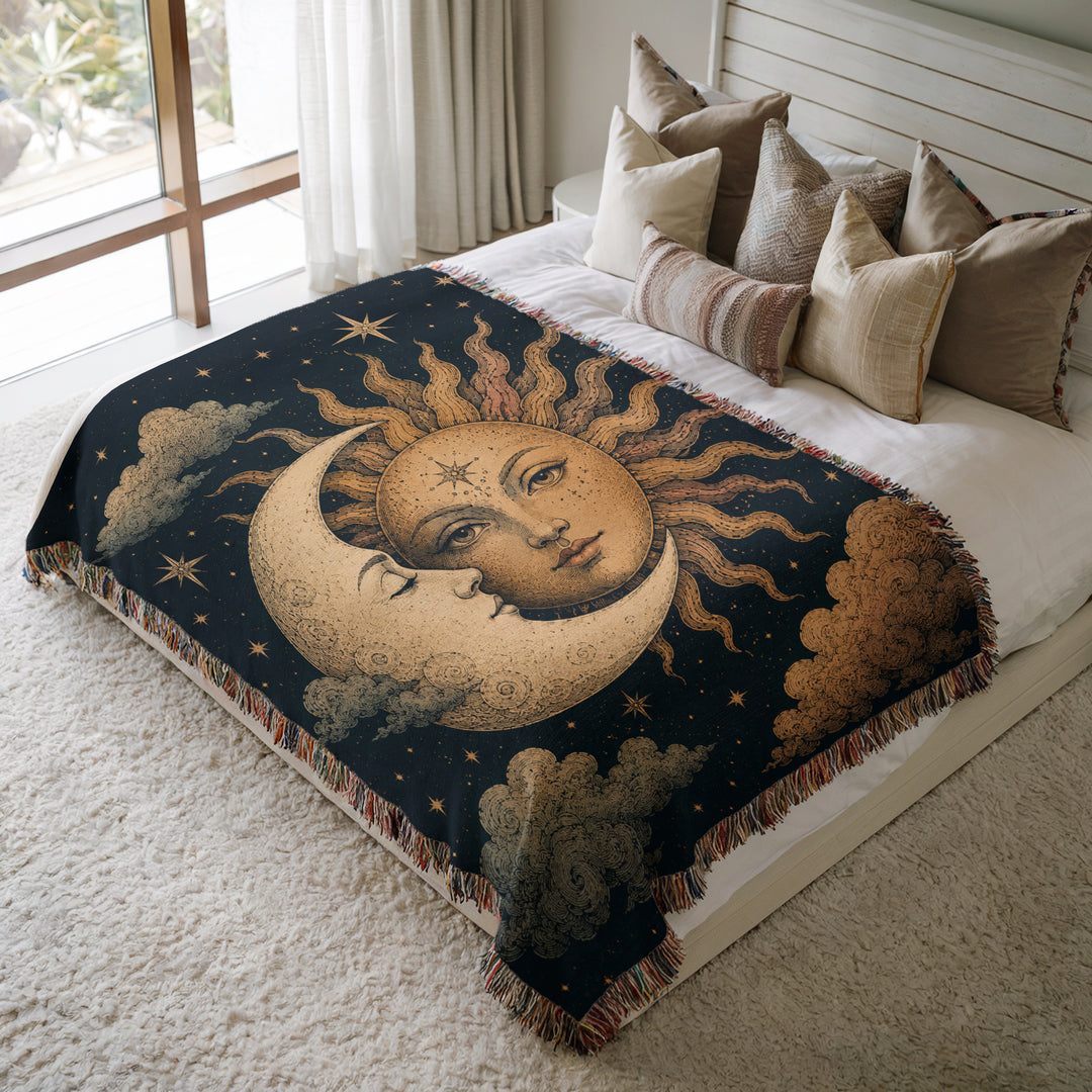 Decorative blanket with celestial design on a bed in a bedroom