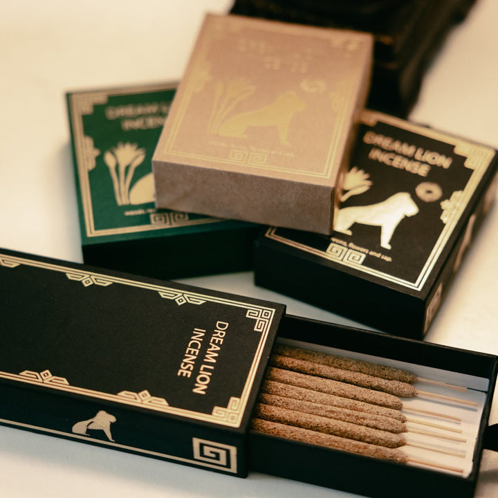 the wish granter open box showing incense sticks and decorative matchbook labels.