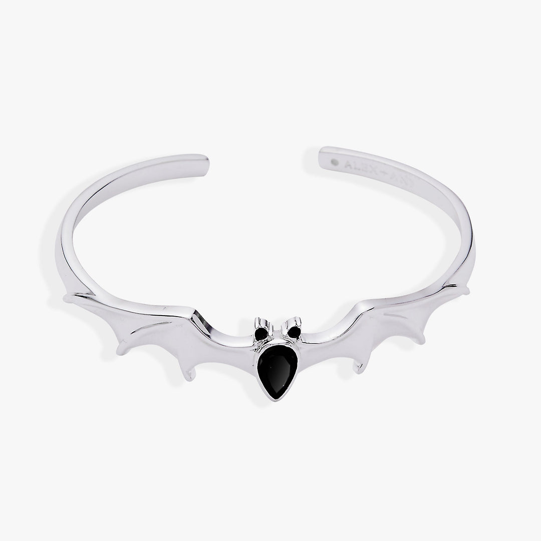 Silver bat-shaped necklace with a black gemstone on a white background