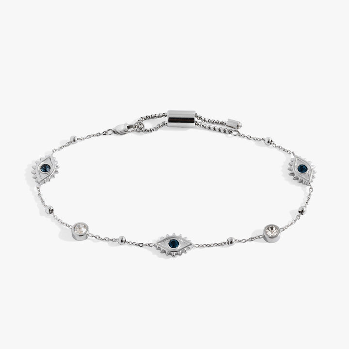 Silver bracelet with evil eye-shaped charms on a white background